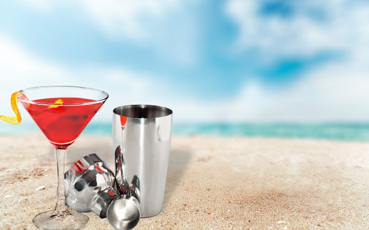 metallic-barman-shaker-with-cocktail-sandy-beach