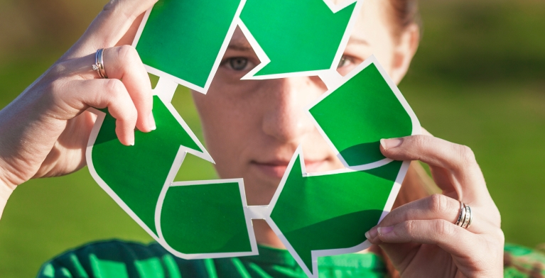 recycle-background-with-woman-holding-recycle-sign